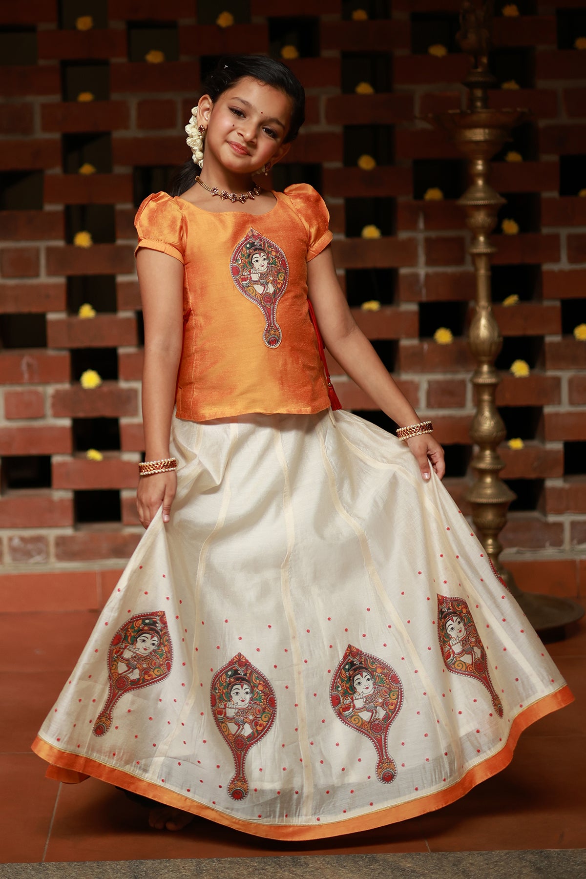 Valkannadi Printed Kids Skirtset with Embroidered Top with Tie up Orange Off White
