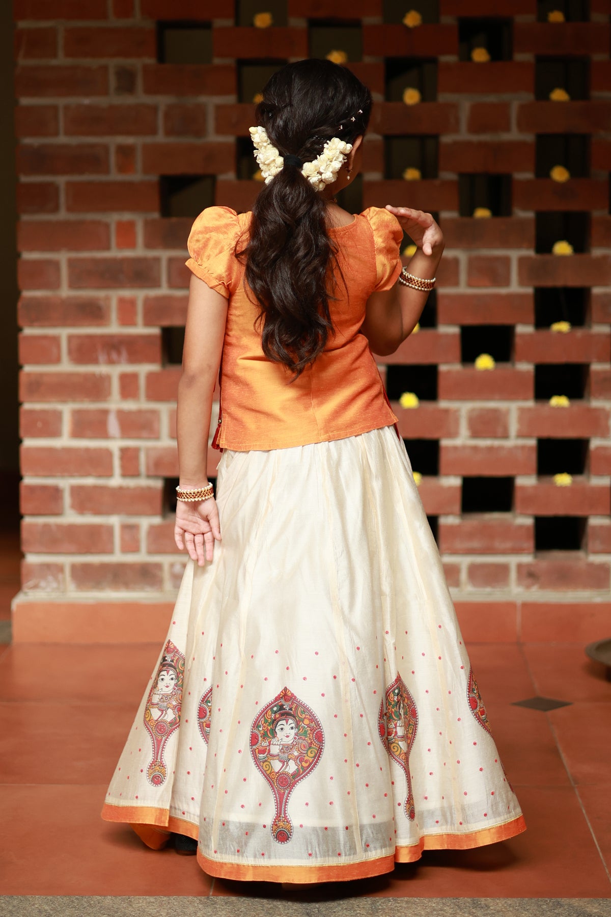 Valkannadi Printed Kids Skirtset with Embroidered Top with Tie up Orange Off White
