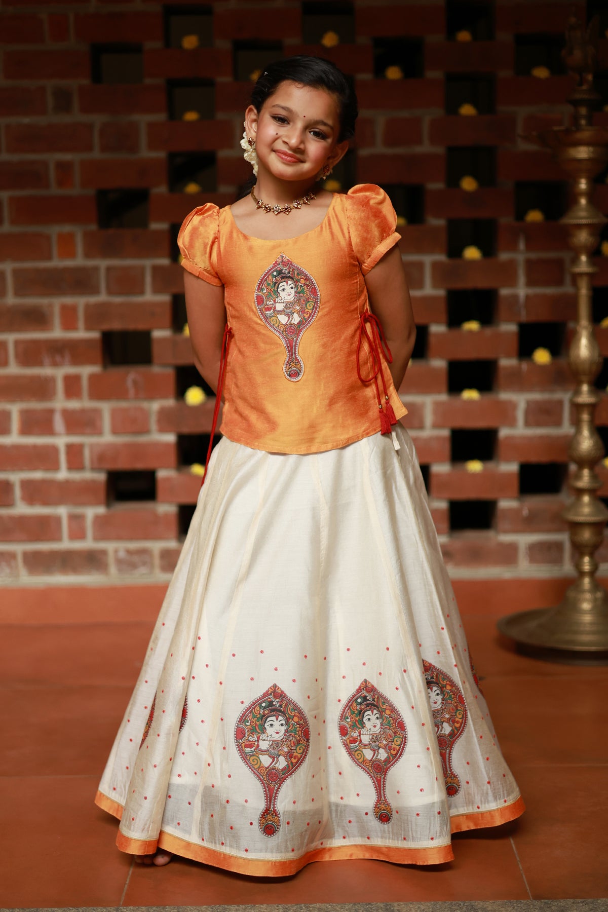 Valkannadi Printed Kids Skirtset with Embroidered Top with Tie up Orange Off White