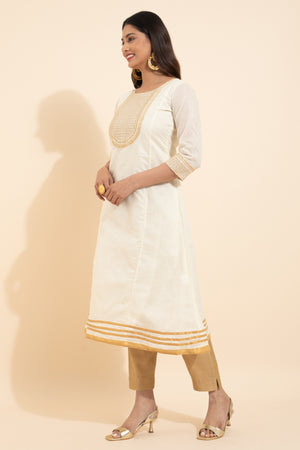 Off white kurta with kasavu for ladies